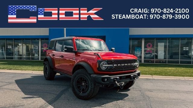 2023 Ford Bronco Wildtrak in Hot Pepper Red Metallic Tinted Clearcoat — front three-quarter view