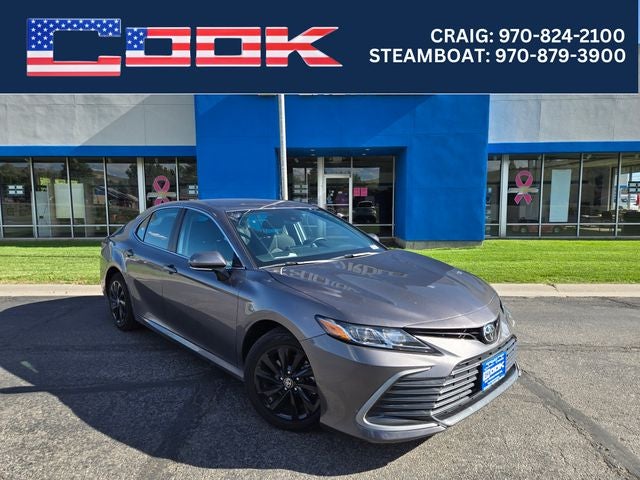 2024 Toyota Camry LE in Predawn Gray Mica — front three-quarter view